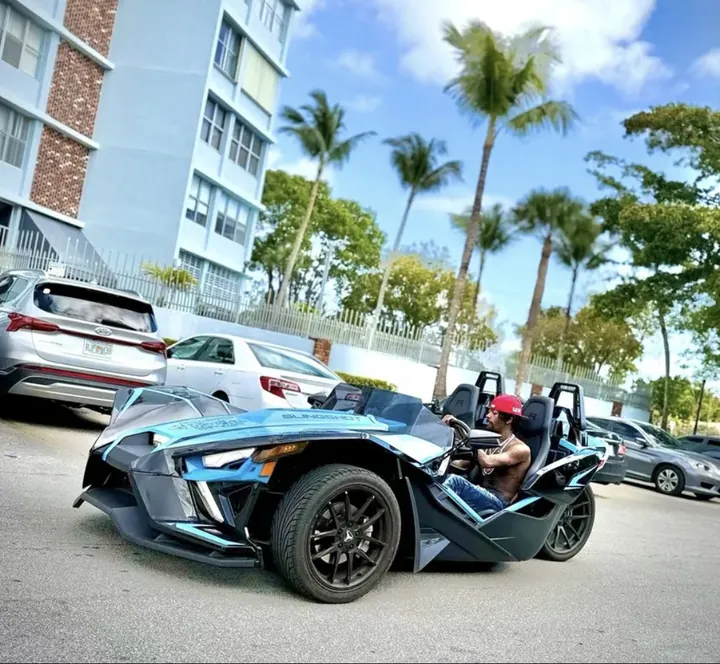 Blue Slingshot Miami — man driving open-air